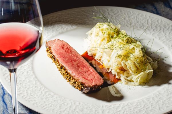 Duck breast with creamy polenta, grilled peach and fennel